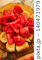 Freshly cut tomatoes and cucumbers filling a bowl, summer salad preparation 140471979