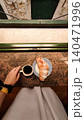 Woman enjoying breakfast with coffee and croissant in croatia 140471996