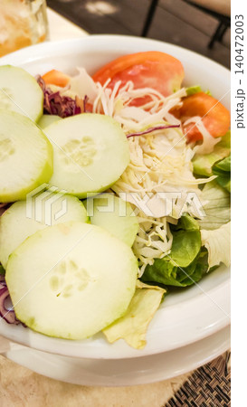 Fresh summer salad with cucumber, tomatoes, and cabbage enjoyed during vacation in croatia Fresh summer salad with cucumber, tomatoes, and cabbage enjoyed during vacation in croatia 140472003