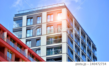 View of modern residential building with glass balconies and bright facade. Contemporary apartment building in european city. Concept of urban living and modern architecture.  140472734