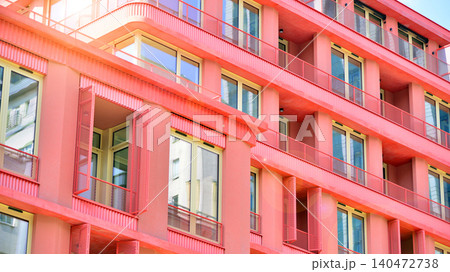 View of modern residential building with glass balconies and bright facade. Contemporary apartment building in european city. Concept of urban living and modern architecture.  140472738