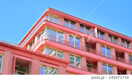 View of modern residential building with glass balconies and bright facade. Contemporary apartment building in european city. Concept of urban living and modern architecture.  140472739
