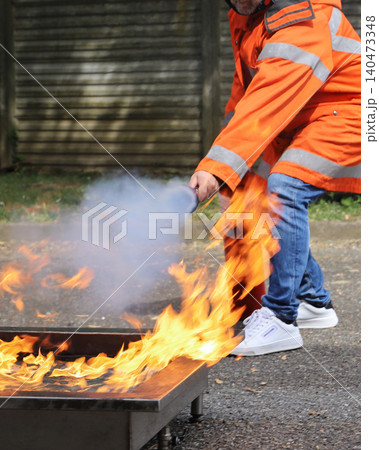 fire prevention. corporate safety - exercise during a firefighting course fire prevention. corporate safety - exercise during a firefighting course 140473348