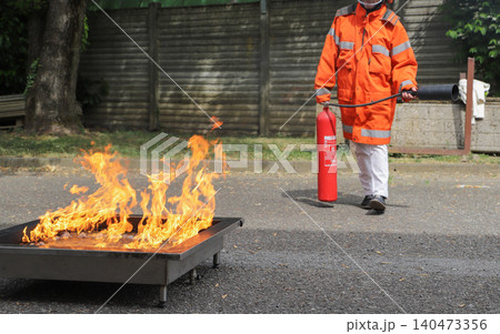 fire prevention. corporate safety - exercise during a firefighting course fire prevention. corporate safety - exercise during a firefighting course 140473356