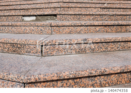Detailed Close-Up of Weathered Stone Steps with Visible Wear and Tear in Urban Environment Detailed Close-Up of Weathered Stone Steps with Visible Wear and Tear in Urban Environment 140474358