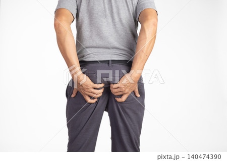 Hemorrhoidal pain, man with hemorrhoids on white background. Hemorrhoidal pain, man with hemorrhoids on white background. 140474390