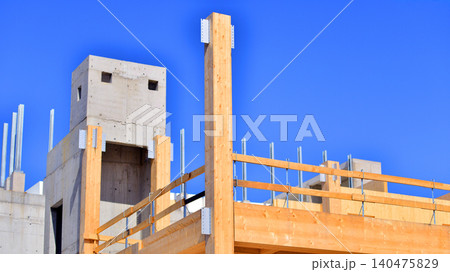 Laminate wood floors and supports of a mass timber multi story green, sustainable office building construction project. The building structure also has concrete walls. Laminate wood floors and supports of a mass timber multi story green, sustainable office building construction project. The building structure also has concrete walls. 140475829