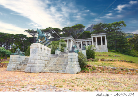 Rhodes Memorial, monument and architecture in Cape Town, outdoor and design for historic building. Tourism, landmark or statue of famous politician, sculpture or art work on mountain in South Africa 140476374