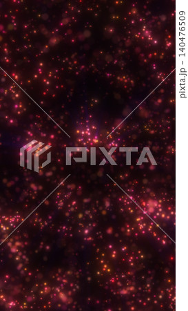 Dark abstract background filled with glowing pink and orange particles, creating a dreamy cosmic sparkle effect with soft bokeh depth. 140476509
