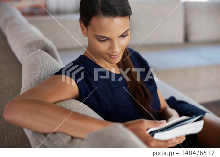 Reading, book and woman relax on sofa in home on holiday or vacation with literature or creative story. Girl, study and learning tips on self care from novel or journal in apartment on calm weekend Reading, book and woman relax on sofa in home on holiday or vacation with literature or creative story. Girl, study and learning tips on self care from novel or journal in apartment on calm weekend 140476517