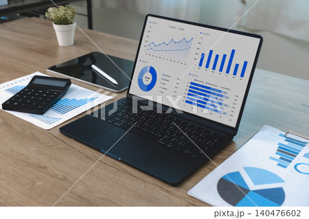 Spreadsheet data and business dashboard displayed on a laptop with charts, reports and calculator, supporting data analysis, performance monitoring, reporting workflow and business management. Spreadsheet data and business dashboard displayed on a laptop with charts, reports and calculator, supporting data analysis, performance monitoring, reporting workflow and business management. 140476602