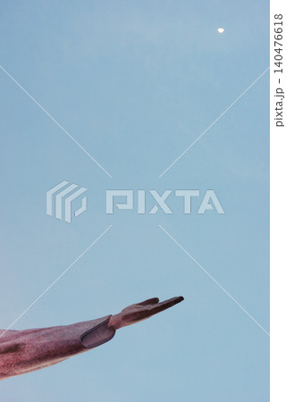 Jesus christ, hand and statue for religious faith, sculpture and art in rio de janeiro. Symbol, peace and history monument for tourism attraction, spiritual and christian journey on blue background Jesus christ, hand and statue for religious faith, sculpture and art in rio de janeiro. Symbol, peace and history monument for tourism attraction, spiritual and christian journey on blue background 140476618