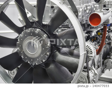 Close view of aircraft engine showing fan and metal components in mechanical workshop Close view of aircraft engine showing fan and metal components in mechanical workshop 140477033