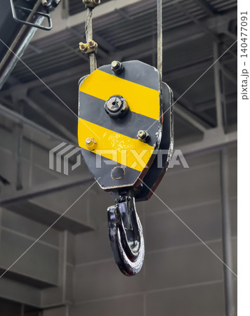 Heavy duty pulley system used in construction site for lifting and moving large loads safely Heavy duty pulley system used in construction site for lifting and moving large loads safely 140477091