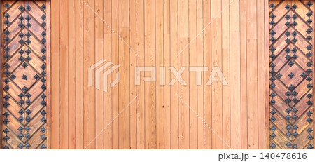Texture of vintage wood board with decorative border with metal rivets. Vertical or horizontal retro background with old wooden plank and aged iron reinforcement. Copy space for text. Mock up template 140478616