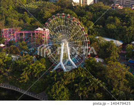 Aerial View of Colorful Ferris Wheel Surrounded by Lush Greenery in Nanning, China Aerial View of Colorful Ferris Wheel Surrounded by Lush Greenery in Nanning, China 140479425