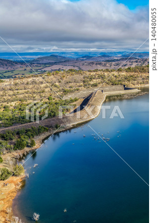 Vertical Aerial view of Glenbawn Dam and the spillway with surrounding landscape in NSW Australia. Drone photograph captures the engineering infrastructure Vertical Aerial view of Glenbawn Dam and the spillway with surrounding landscape in NSW Australia. Drone photograph captures the engineering infrastructure 140480055
