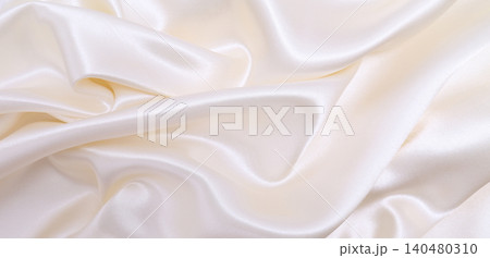 Smooth elegant white silk or satin luxury cloth texture as wedding background. Luxurious background design Smooth elegant white silk or satin luxury cloth texture as wedding background. Luxurious background design 140480310