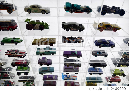 Carefully organized tiny vehicle arrangements displayed beneath glass grid ceiling with lighting Carefully organized tiny vehicle arrangements displayed beneath glass grid ceiling with lighting 140480660