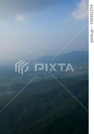 Looking from the airplane window with Hong Kong cityscape. The view of Hong Kong city, Hong Kong landscape from the above. Landscape, travel concept and nature scene.  140482254