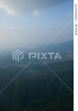 Looking from the airplane window with Hong Kong cityscape. The view of Hong Kong city, Hong Kong landscape from the above. Landscape, travel concept and nature scene. Looking from the airplane window with Hong Kong cityscape. The view of Hong Kong city, Hong Kong landscape from the above. Landscape, travel concept and nature scene. 140482255