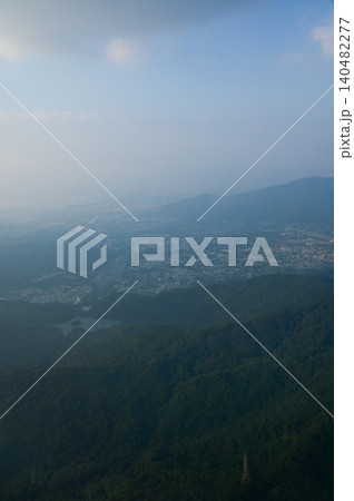 Looking from the airplane window with Hong Kong cityscape. The view of Hong Kong city, Hong Kong landscape from the above. Landscape, travel concept and nature scene. Looking from the airplane window with Hong Kong cityscape. The view of Hong Kong city, Hong Kong landscape from the above. Landscape, travel concept and nature scene. 140482277