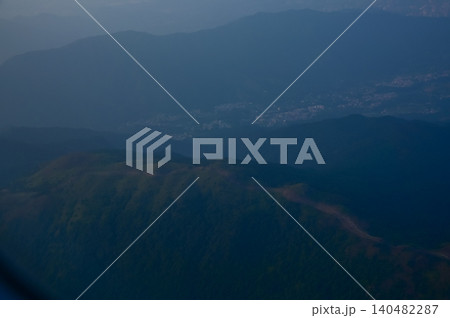 Looking from the airplane window with the scene of Tai Mo Shan, Hong Kong. Tai Mo Shan, the highest mountain in Hong Kong. Hong Kong landscape from the above. Landscape, travel concept, nature scene 140482287