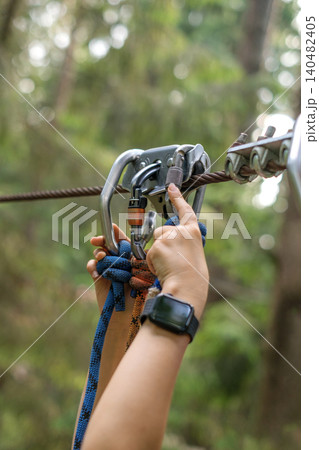 A close-up carbine for descending the cable. Safety equipment A close-up carbine for descending the cable. Safety equipment 140482405