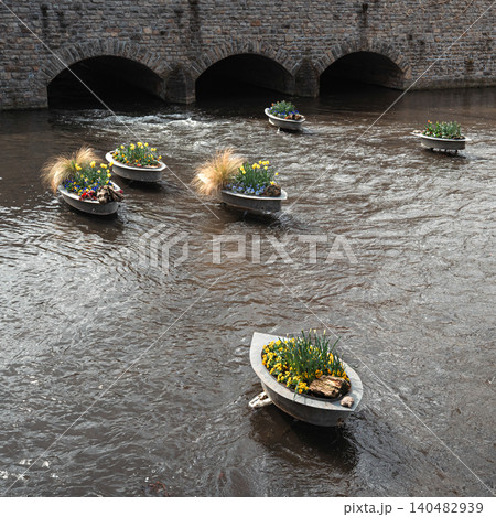 Spring Flower Planters Floating on Urban River Spring Flower Planters Floating on Urban River 140482939