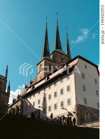 Erfurt, Germany - March 27, 2026. Cathedral Towers Above Old Town Steps Erfurt, Germany - March 27, 2026. Cathedral Towers Above Old Town Steps 140482955