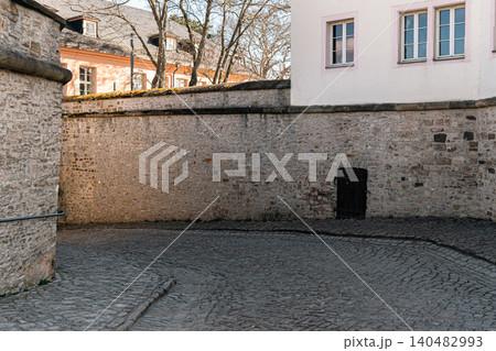 Historic Stone Wall and Cobblestone Street Texture 140482993