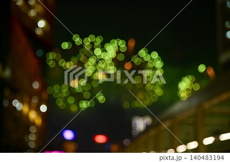 Bokeh effect of colorful fireworks display in the night sky. Real fireworks background. Abstract of real shining fireworks against black background. Glowing fireworks show for celebration. Bokeh effect of colorful fireworks display in the night sky. Real fireworks background. Abstract of real shining fireworks against black background. Glowing fireworks show for celebration. 140483194