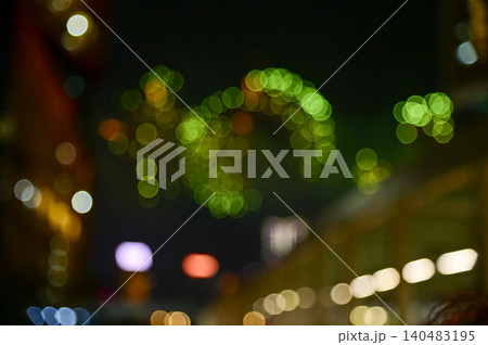 Bokeh effect of colorful fireworks display in the night sky. Real fireworks background. Abstract of real shining fireworks against black background. Glowing fireworks show for celebration. Bokeh effect of colorful fireworks display in the night sky. Real fireworks background. Abstract of real shining fireworks against black background. Glowing fireworks show for celebration. 140483195