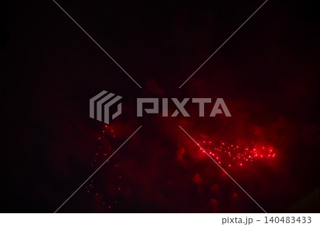 Stunning and colorful fireworks display in the night sky with smoke during explosion. Real fireworks background. Abstract of real shining fireworks against black background. for celebration. Stunning and colorful fireworks display in the night sky with smoke during explosion. Real fireworks background. Abstract of real shining fireworks against black background. for celebration. 140483433