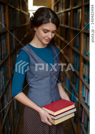 Young girl choose books for reading. Young girl choose books for reading. 140483494