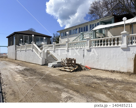 A coastal property undergoing renovation or construction. . A pile of sand on the embankment construction site. Construction materials A coastal property undergoing renovation or construction. . A pile of sand on the embankment construction site. Construction materials 140485211