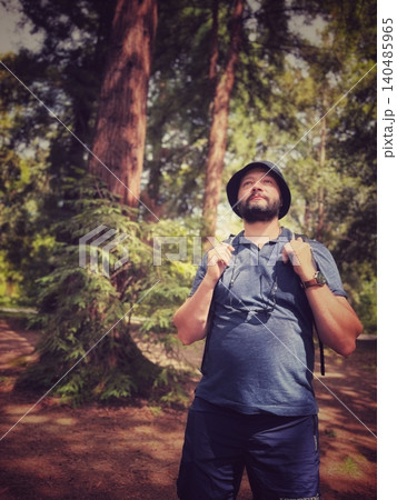 man with backpack travelling in rainforest 140485965