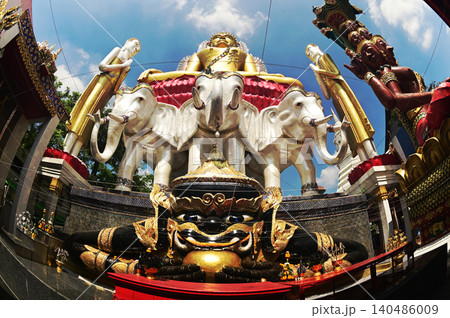 Rahu statue front of golden Buddha and tree headed elephant statue. Located at Wat Khun Jun temple in Bangkok , Thailand. Rahu statue front of golden Buddha and tree headed elephant statue. Located at Wat Khun Jun temple in Bangkok , Thailand. 140486009