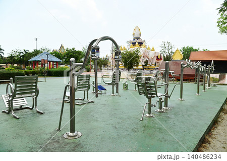 A variety of stainless steel exercise equipment is available for users to enjoy in Bang Sai Park, a local public park. 140486234