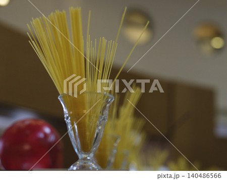 uncooked decorative spaghetti pastas in the kitchen uncooked decorative spaghetti pastas in the kitchen 140486566
