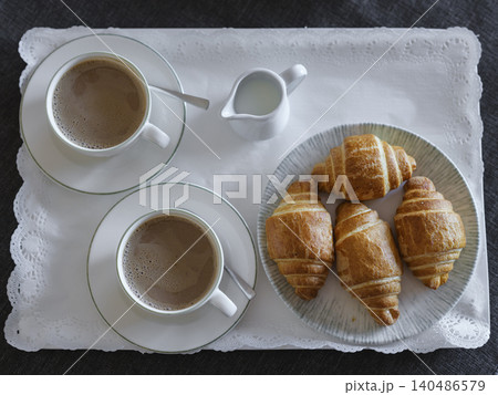 breakfast with coffee and croissant in hotel room 140486579