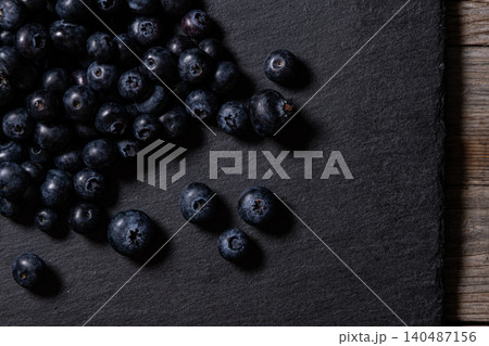 Fresh Blueberries Piled on Granite Surface. Fresh Blueberries Piled on Granite Surface. 140487156