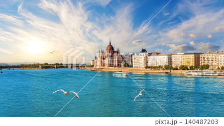 Budapest cityscape with Danube river and Parliament under moody storm clouds at dusk, Hungary 140487203