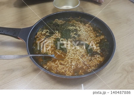 Steaming Ramen with Leafy Greens in Pan Steaming Ramen with Leafy Greens in Pan 140487886