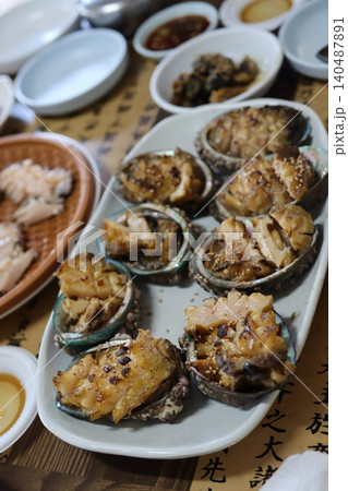 Grilled Abalone Dish with Sesame and Spices Grilled Abalone Dish with Sesame and Spices 140487891