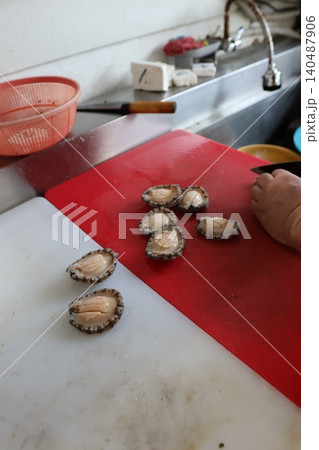 Fresh Scallops on Cutting Board in Kitchen 140487906