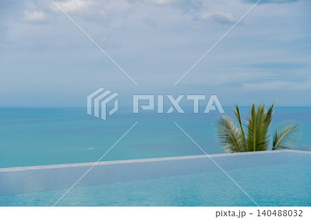 Clean Minimalist Ocean View from Luxury Poolside with Coconut Leaf Travel Background with Copy Space Clean Minimalist Ocean View from Luxury Poolside with Coconut Leaf Travel Background with Copy Space 140488032