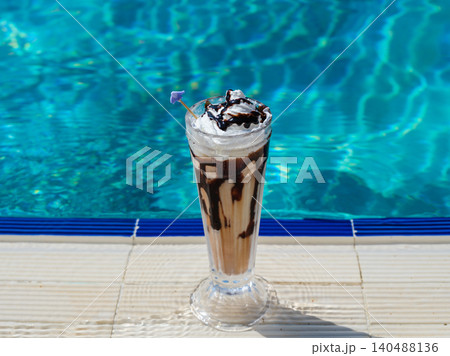 delicious cold coffee by the pool 140488136