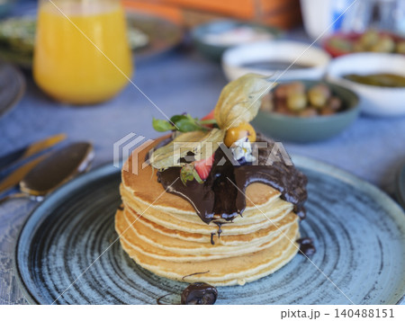 delicious chocolate pancakes on plate delicious chocolate pancakes on plate 140488151