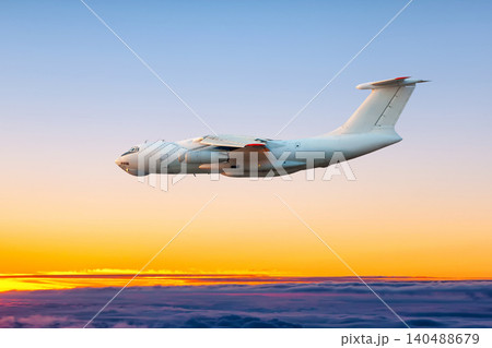 White wide body transport cargo airplane flying above the cumulus sunset sky White wide body transport cargo airplane flying above the cumulus sunset sky 140488679